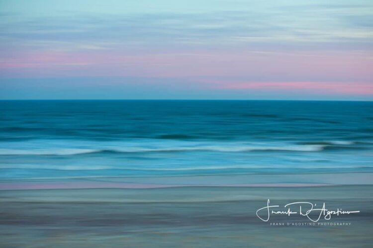 a pink and blue oceanscape